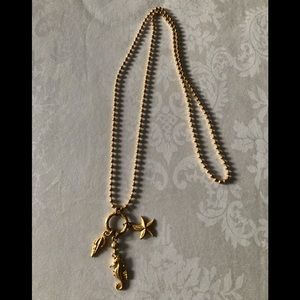 Gold tone summer motif necklace